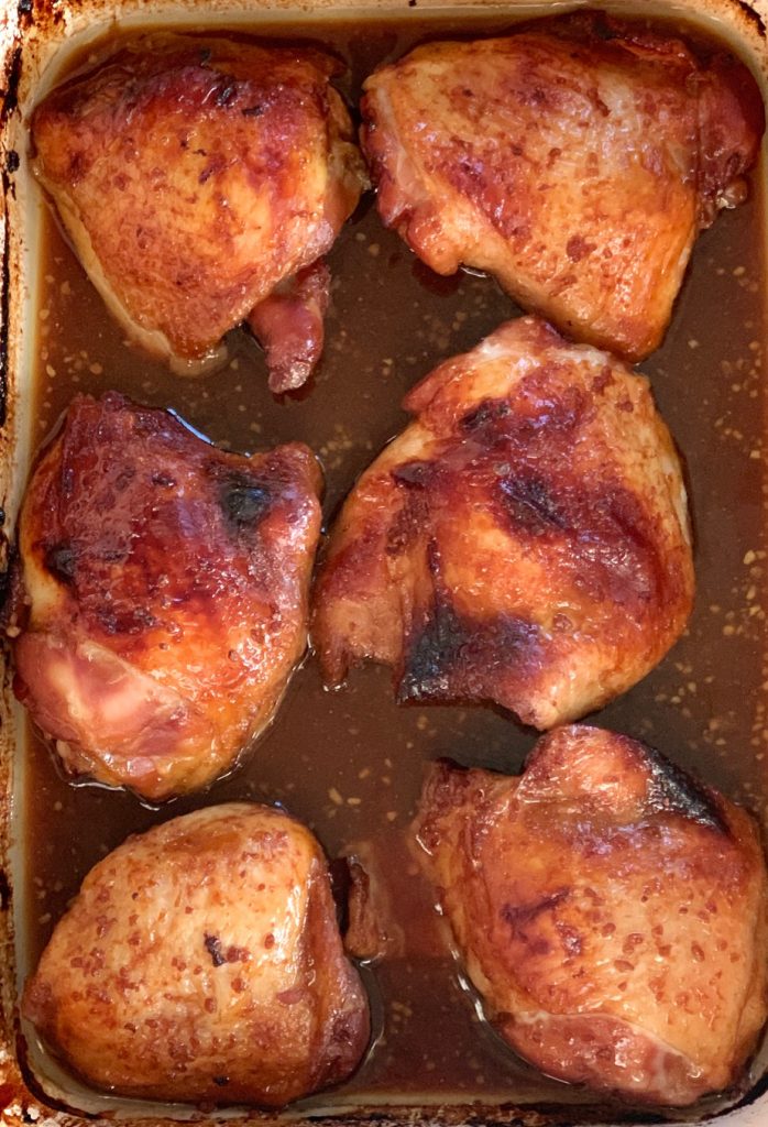 Asian Baked Chicken in a pan with sauce
