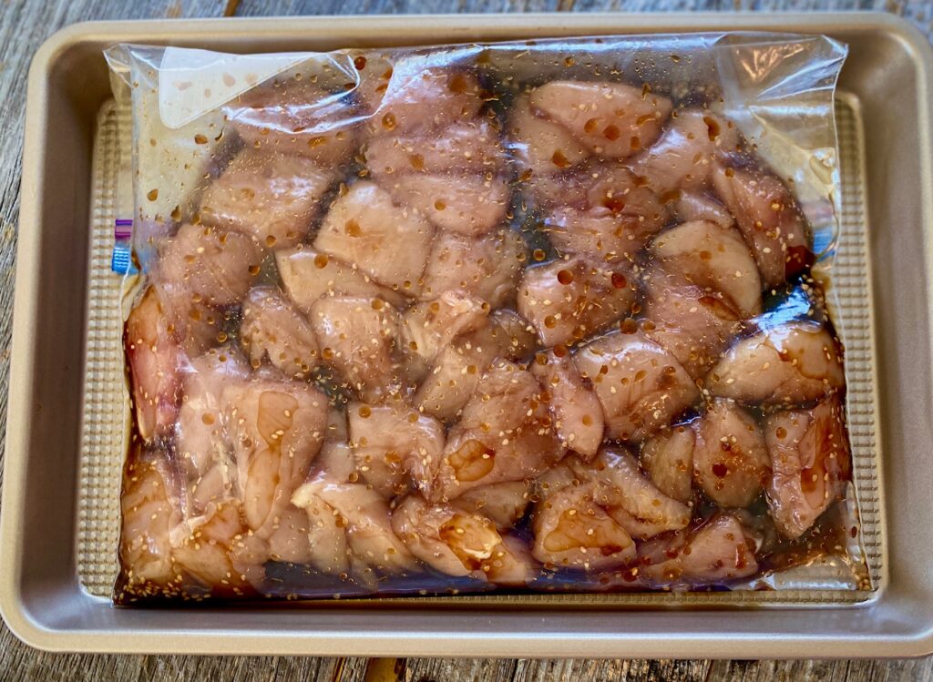 chicken pieces marinating a plastic bag
