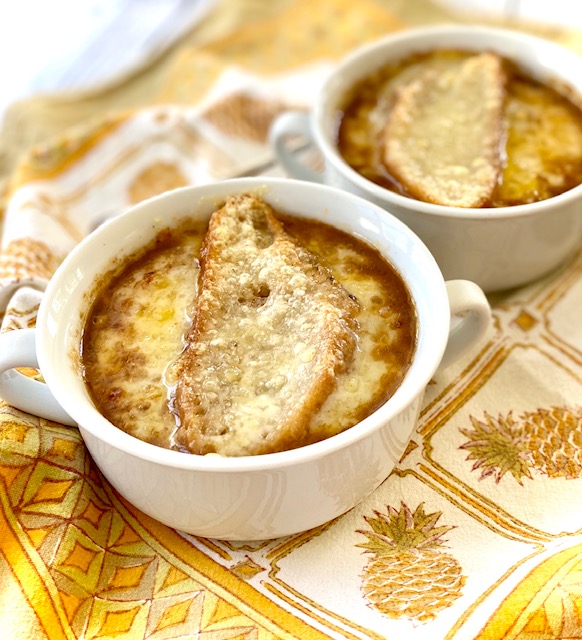 2 bowls of French Onion Soup with swiss cheese