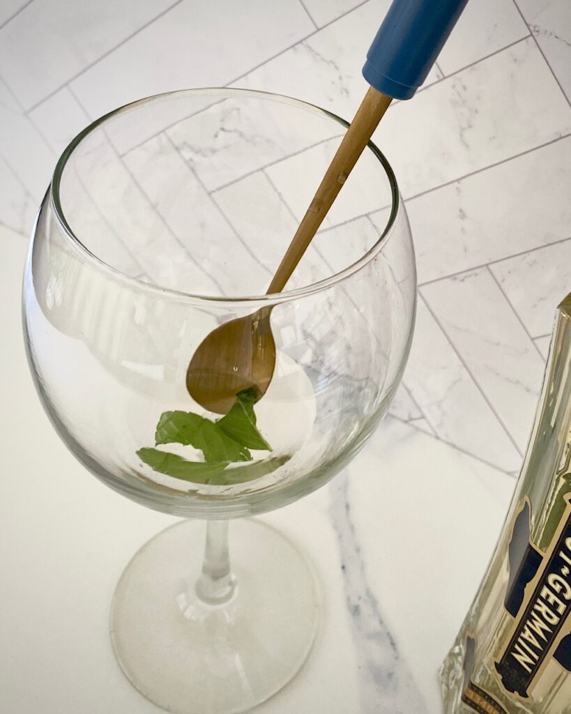 muddling mint in glass