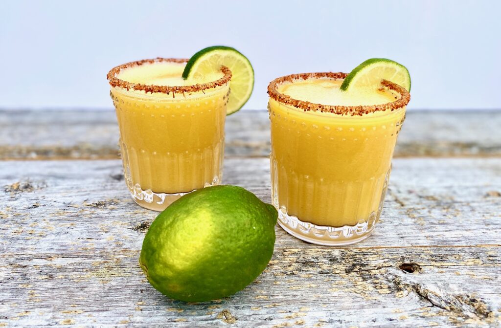 2 mango margaritas with lime