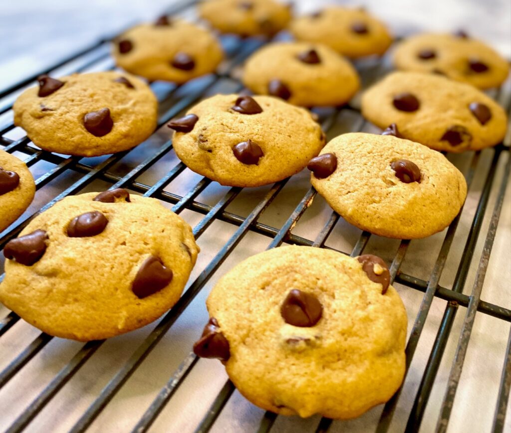 Pumpkin cookies unglazed on cooling rack