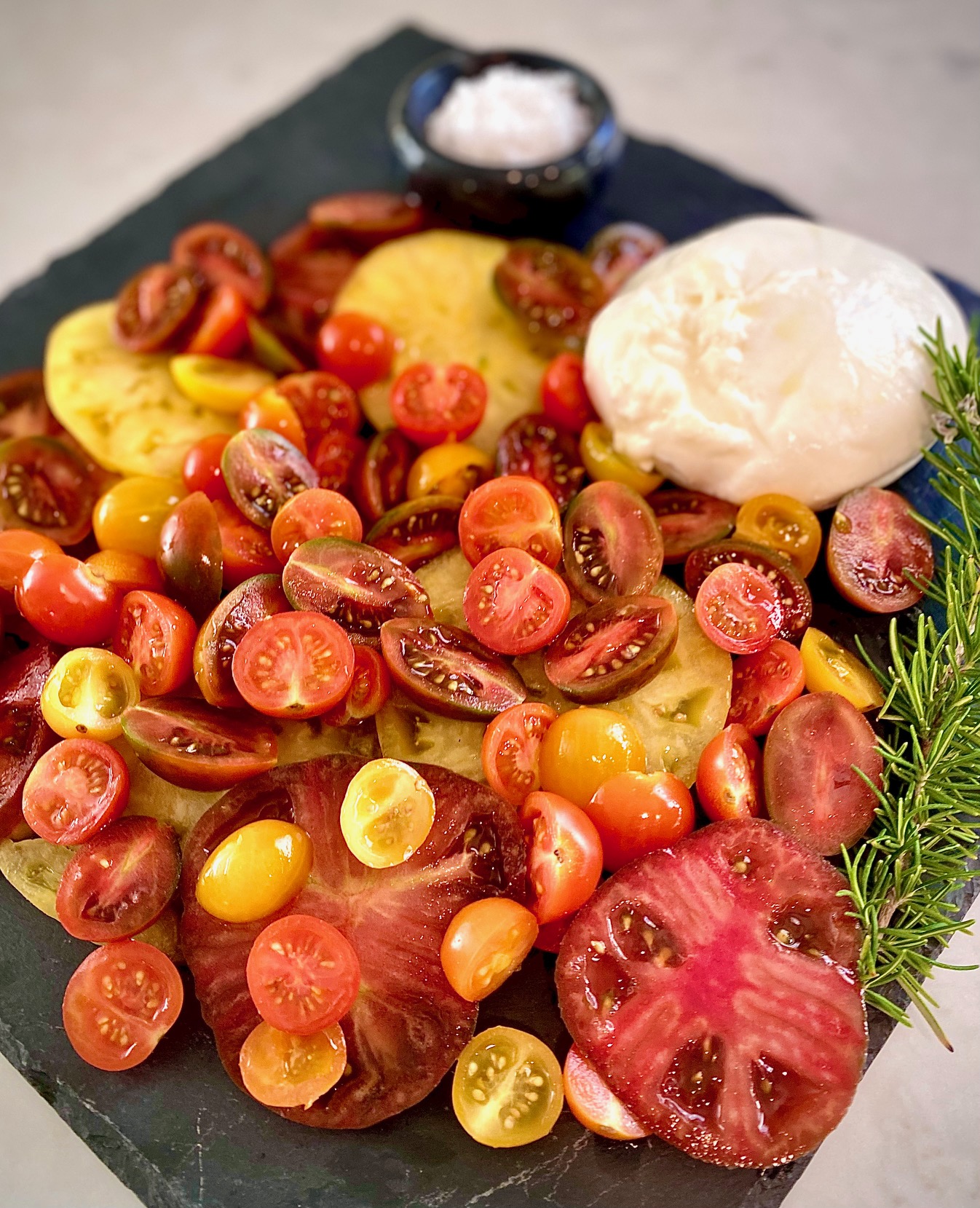 platter of tomatoes and burrata cheese